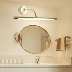 Bathroom mirror with sconce photo