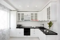 White kitchen with black apron photo
