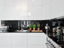 White kitchen with black apron photo