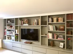 Wall of shelves in the living room photo