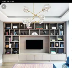 Wall of shelves in the living room photo