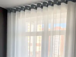 Tulle on eyelets in the living room photo