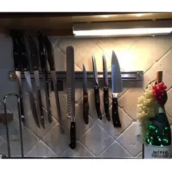Magnet for knives photo in the kitchen
