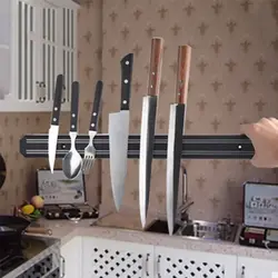 Magnet for knives photo in the kitchen