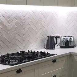 Herringbone tiles for kitchen backsplash photo