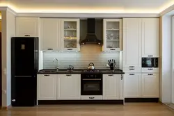 Black Appliances In A Beige Kitchen Photo