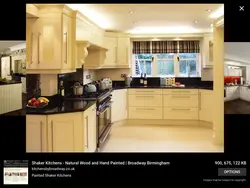 Black appliances in a beige kitchen photo