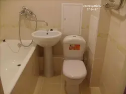Toilet Between Bathtub And Sink Photo