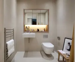 Toilet between bathtub and sink photo