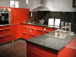 Photo of a kitchen with a red countertop photo