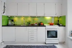 White kitchens with green apron photo