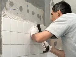 Plaster under tiles in the bathroom photo