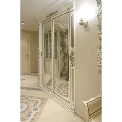 White mirrored wardrobe in the hallway photo
