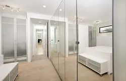 White mirrored wardrobe in the hallway photo