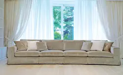 Large straight sofa in the living room photo