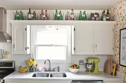 Shelves in the kitchen under the ceiling photo
