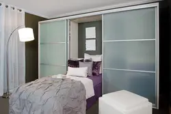 Wardrobe Behind The Bed In The Bedroom Photo