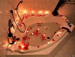 Bath with rose petals and candles photo