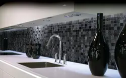 Kitchen apron made of black tiles photo