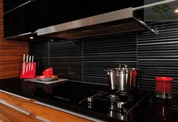 Kitchen apron made of black tiles photo