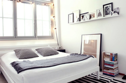Bed with feet to the window in the bedroom photo