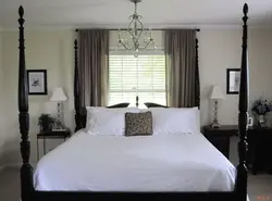 Bed With Feet To The Window In The Bedroom Photo