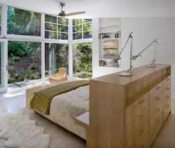 Bed with feet to the window in the bedroom photo