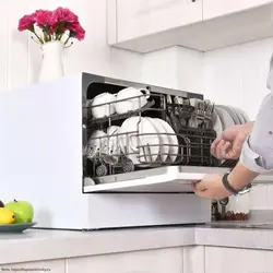 Tabletop dishwasher in the kitchen interior photo