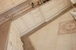Beige tiles on the kitchen floor photo