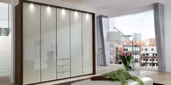 Hinged wardrobes with a mirror in the bedroom photo