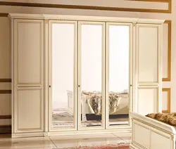 Hinged wardrobes with a mirror in the bedroom photo