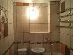 Grout for beige tiles in the bathroom photo