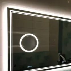 Touch-sensitive bathroom mirrors with light photo