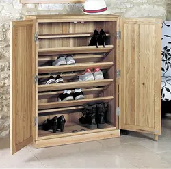 Wooden shoe rack in the hallway photo