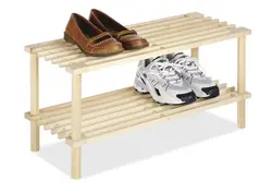 Wooden shoe rack in the hallway photo