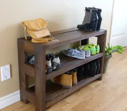Wooden shoe rack in the hallway photo