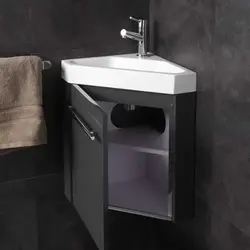 Small bathroom sink with cabinet photo