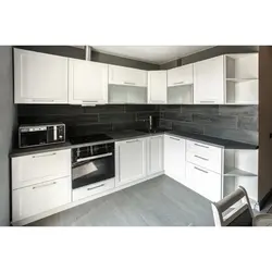 White kitchen with dark gray countertop photo