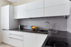 White Kitchen With Dark Gray Countertop Photo