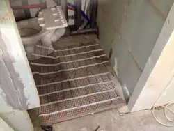 Heated floor in the bathroom under tiles photo