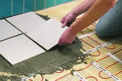 Heated floor in the bathroom under tiles photo