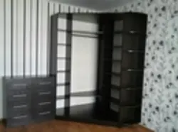 Corner Wardrobe With Chest Of Drawers In The Bedroom Photo