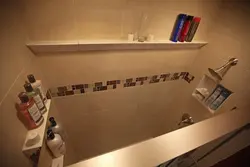 Corner shelves in the bathroom made of tiles photo