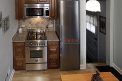 Photo of kitchen with stove and refrigerator photo