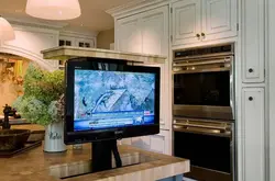TV in the kitchen in a small kitchen photo