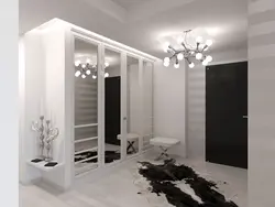 White hallway wardrobe with mirror photo