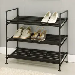 Photo of metal shoe racks in the hallway