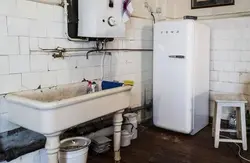 Photo of a bathtub in the kitchen in old houses