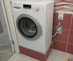 Socket in the bathroom for the washing machine photo