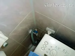 Socket in the bathroom for the washing machine photo